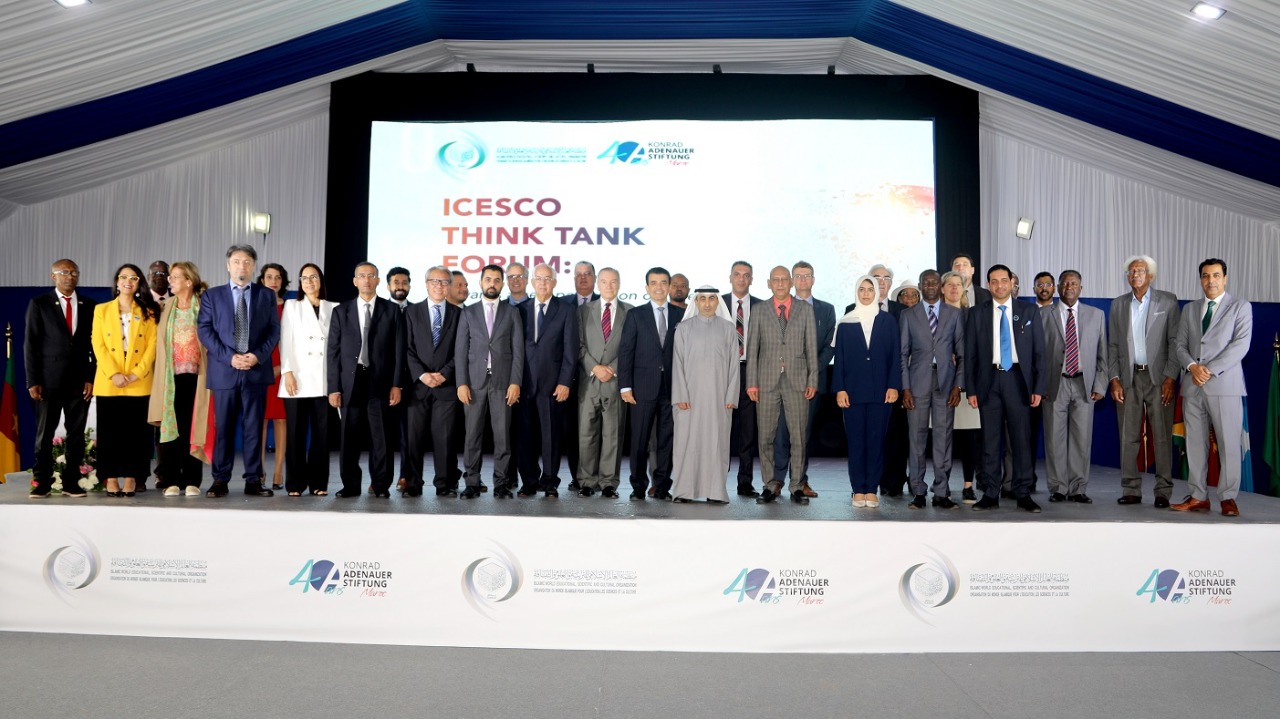 International delegates stand on stage before a large screen reading ICESCO Think Tank Forum.