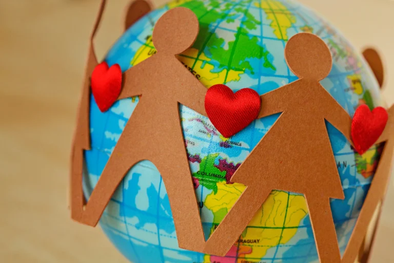paper-people-with-hearts-circle-around-earth-globe-concept-environmental-issues