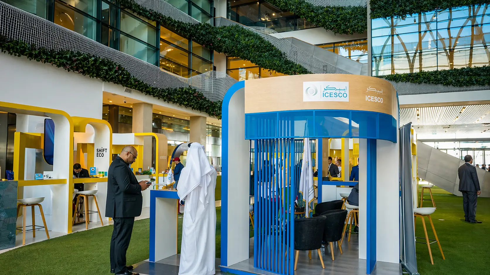 ICESCO and Shift Eco booths in a greenery-filled atrium