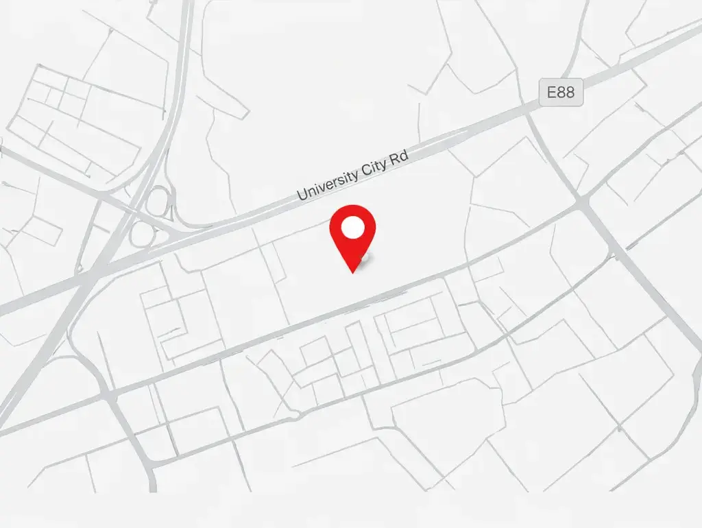 A light gray street map places a red pin beside University City Road and highway E88.